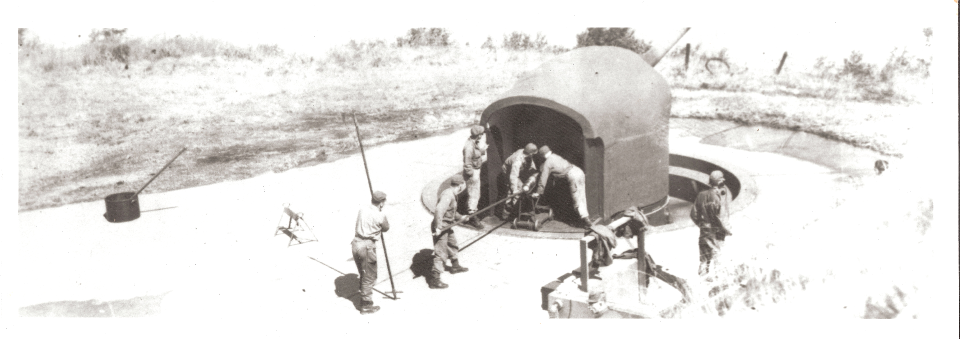 Soldiers loading a gun at Battery 245, Fort Stevens, during World War II